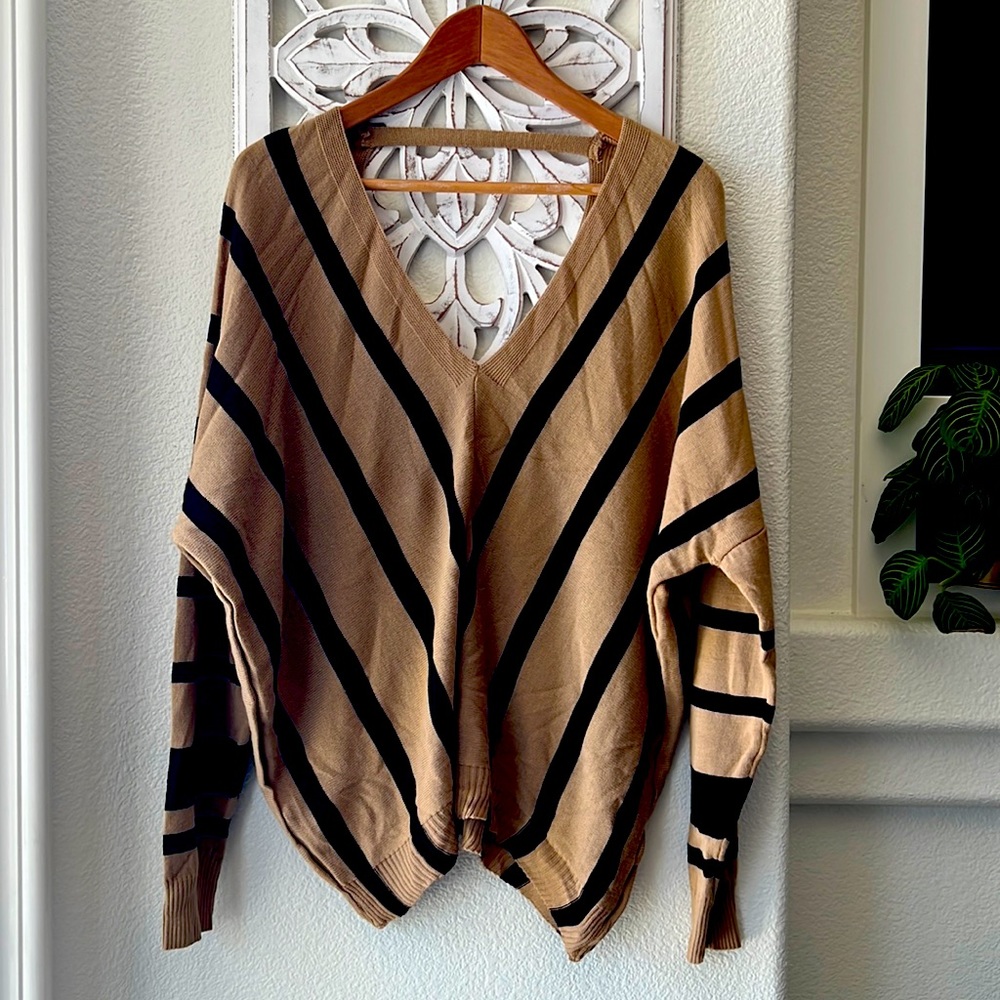 Oversized, deep V, sweater.
